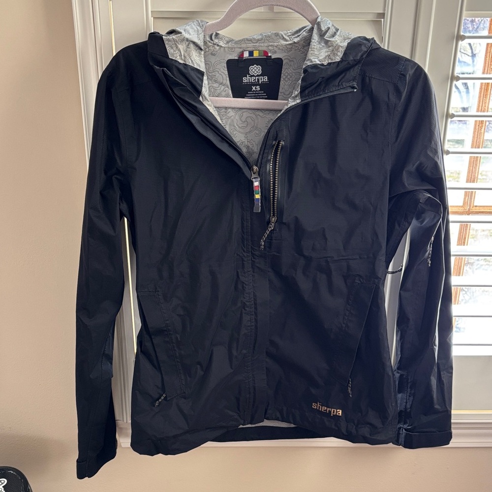 Sherpa adventure gear rain jacket